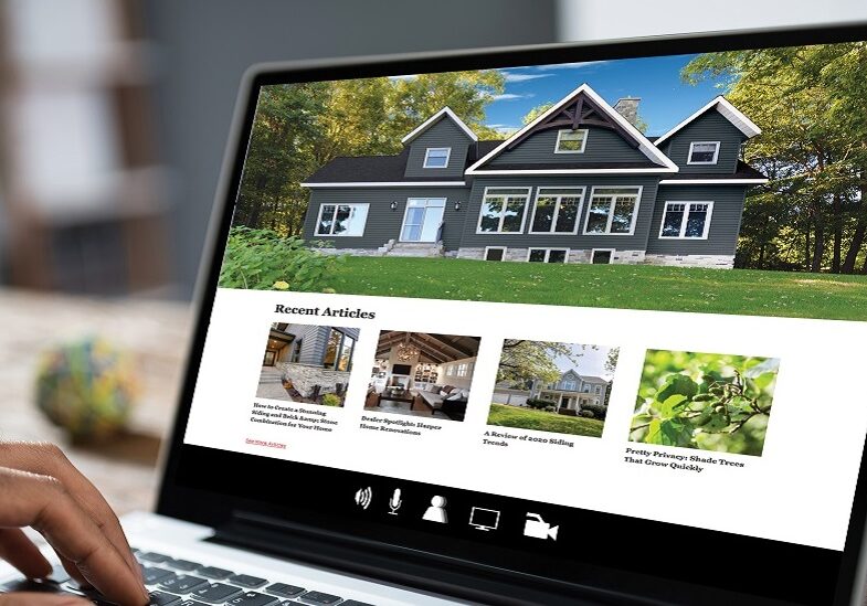 Cropped Image Of Businessman Using Laptop At Desk In Office